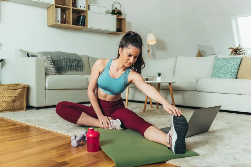 A young girl stretching before workout