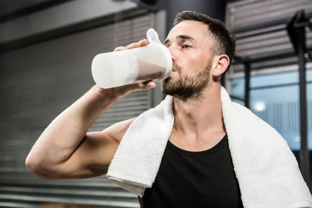 Man dirking protein drink mix. 