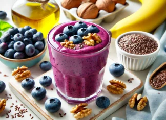 A vibrant blueberry smoothie in a clear glass, garnished with fresh blueberries and walnuts. Surrounding the glass are ingredients including a banana, walnuts, flaxseeds, and a bottle of olive oil, emphasizing brain-boosting nutrition.