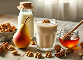 A creamy smoothie in a clear glass, surrounded by a ripe pear, walnuts, cinnamon sticks, honey, and almond milk on a sunlit wooden kitchen surface—perfectly styled to reflect a brain-boosting, nutty blend for cognitive support.